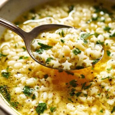 Creamy pastina cooked in broth, finished with butter, cheese, and herbs