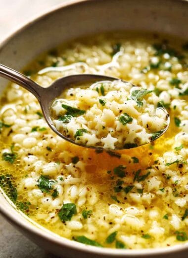 Creamy pastina cooked in broth, finished with butter, cheese, and herbs