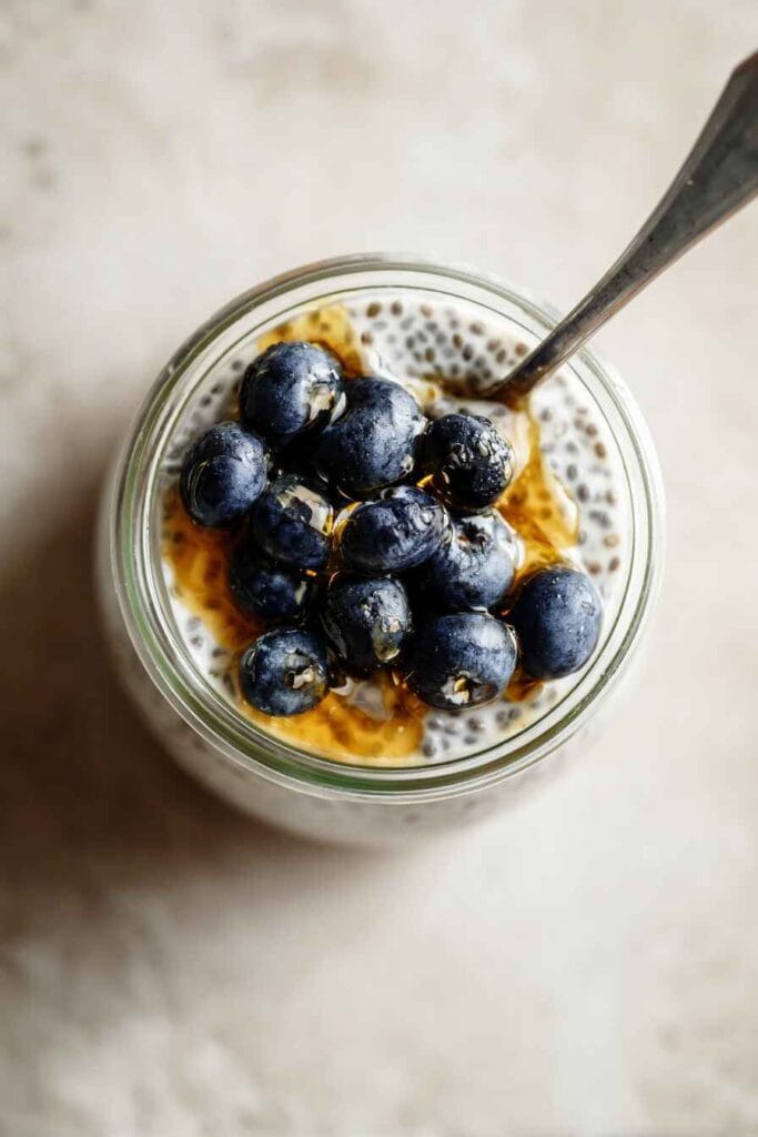 blueberry chia seed pudding with greek yogurt topped with honey