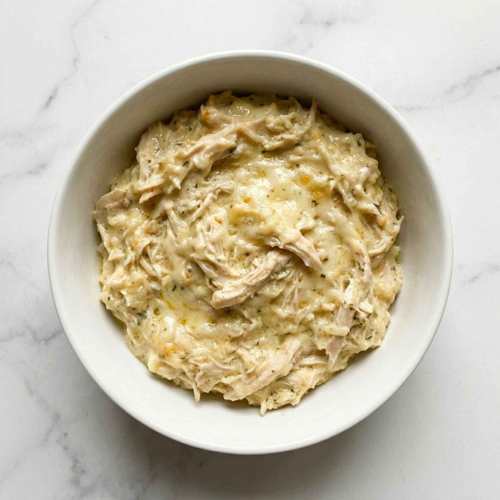 Creamy chicken filling for low carb chicken pot pie in a white bowl