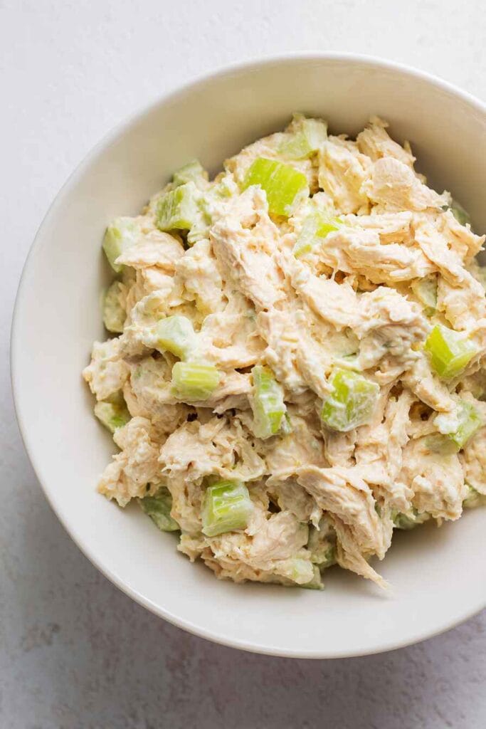 creamy high protein chicken salad close-up with shredded chicken and celery
