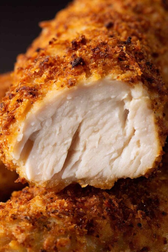 Low calorie chicken strip showing the inside chicken texture