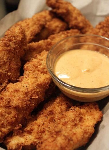 Low calorie chicken strips served crispy with dipping sauce