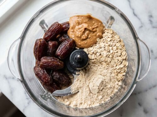 ingredients for high protein date balls in a food processor before blending