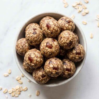 high protein date balls in a bowl with oats and visible date pieces