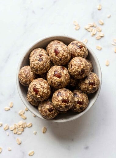 high protein date balls in a bowl with oats and visible date pieces