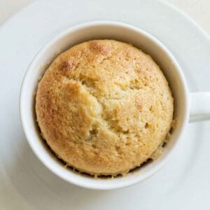 Cooked high protein mug cake in a mug with a soft and fluffy texture