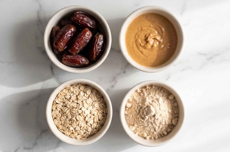ingredients for high protein date balls including dates peanut butter oats and protein powder